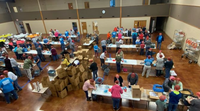 Area Churches come together to pack food for people in Ukraine