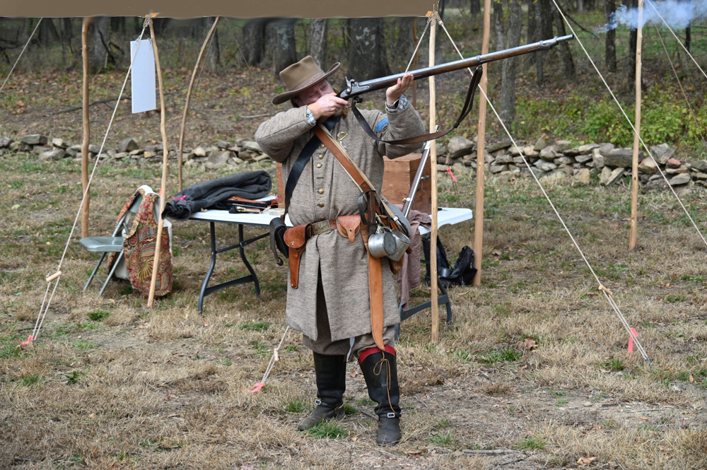 Matt Wells demonstrates a flintlock rifle